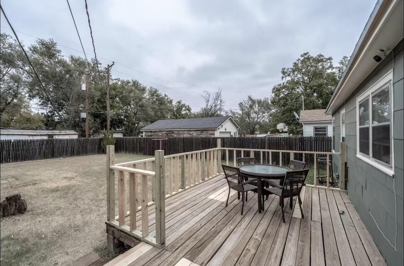 2816 37th Street Lubbock, TX 79413 - Photo 3 of 19 a view of balcony with deck and wooden floor