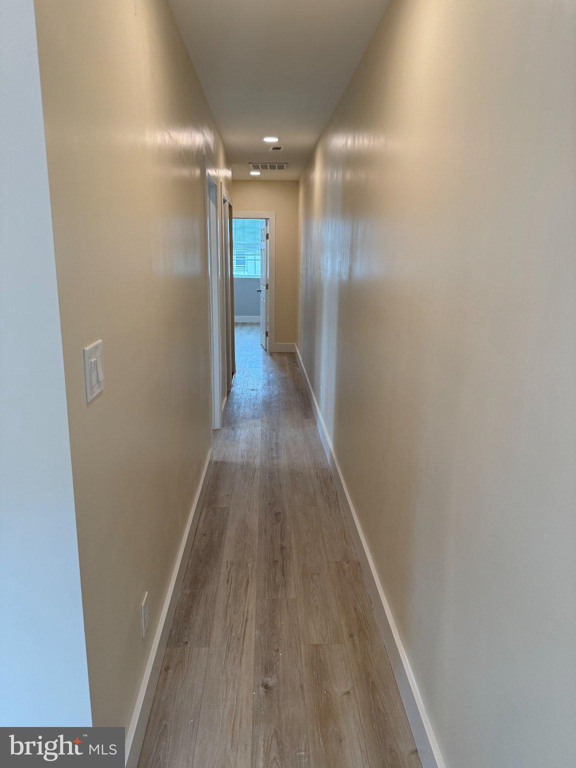 1930 North Payson Street Baltimore, MD 21217 - Photo 11 of 12 a view of hallway with wooden floor