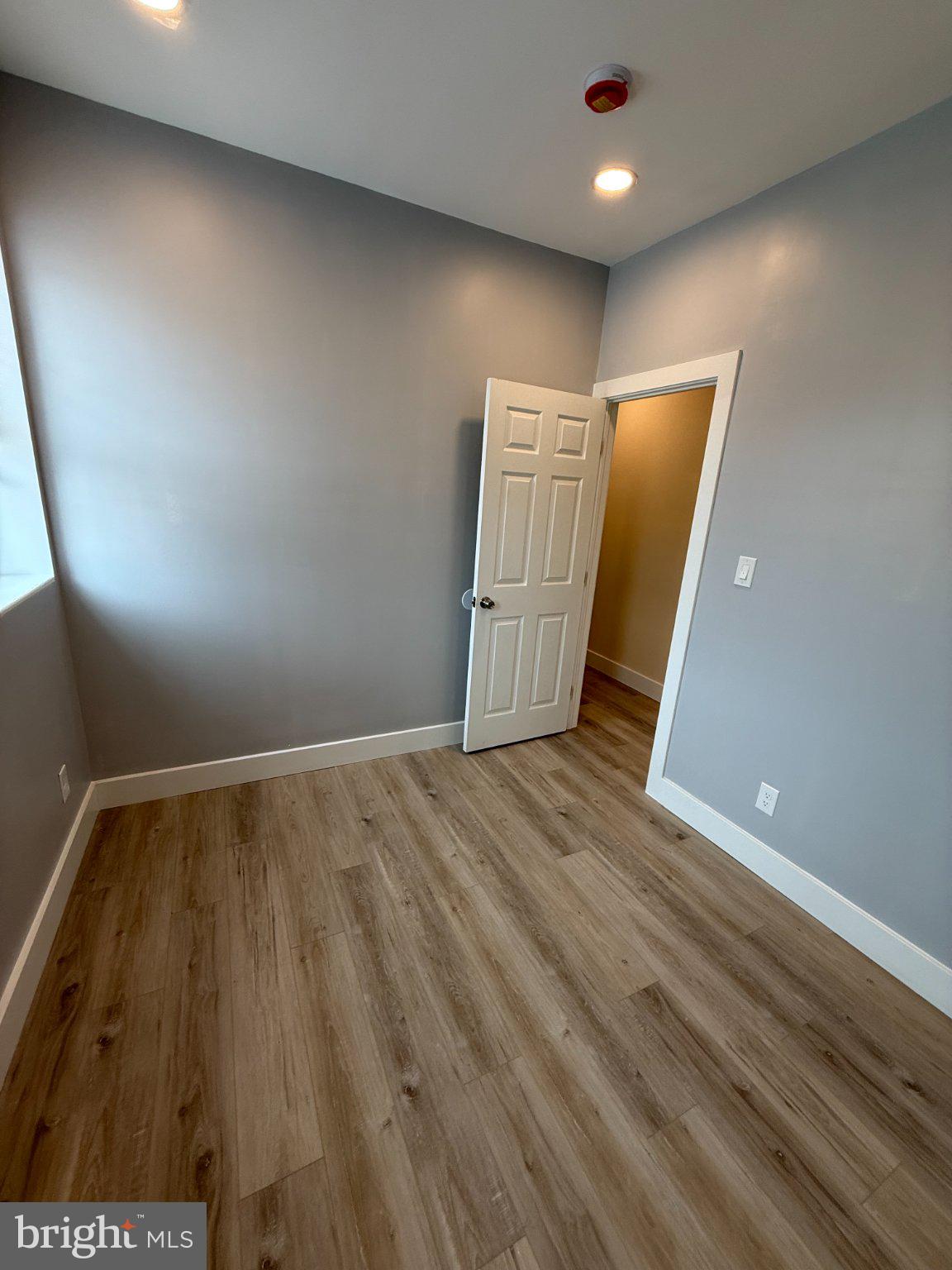 1930 North Payson Street Baltimore, MD 21217 - Photo 10 of 12 a view of empty room with wooden floor