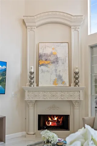 a fireplace with a vase on top of it