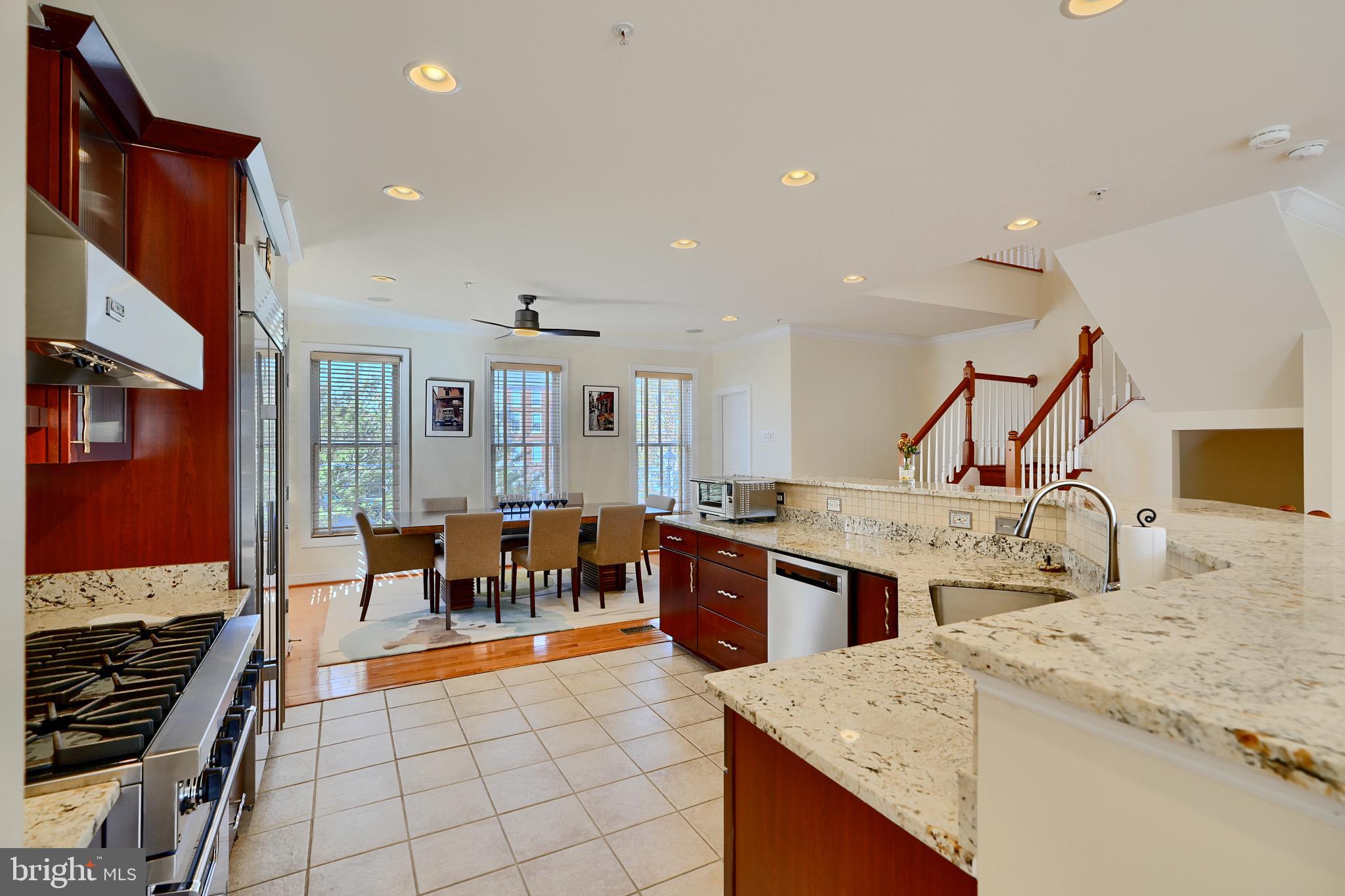 1221 Dockside Circle Baltimore, MD 21224 - Photo 18 of 57 a dining hall with stainless steel appliances granite countertop a stove and a sink