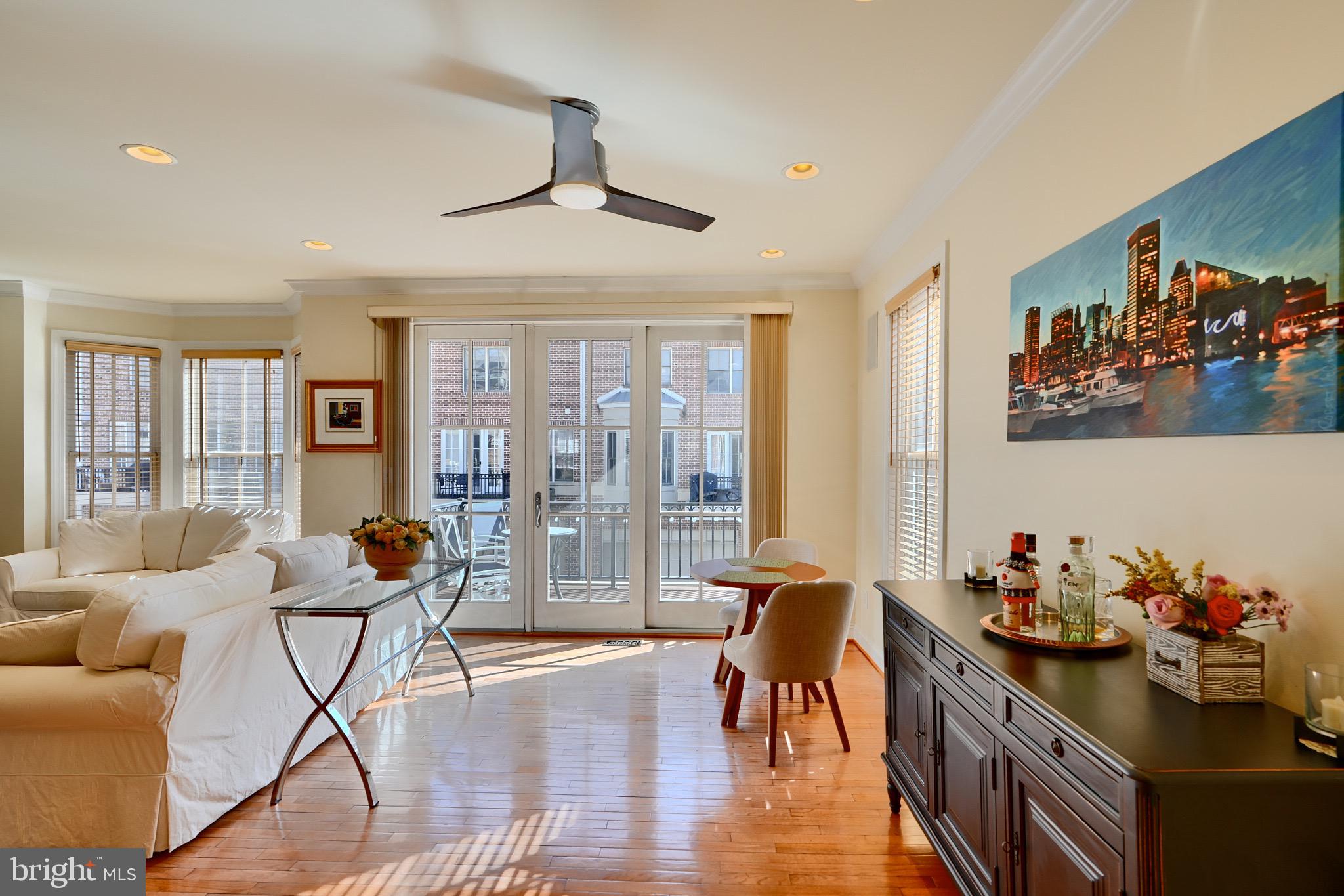 1221 Dockside Circle Baltimore, MD 21224 - Photo 19 of 57 a living room with furniture and wooden floor