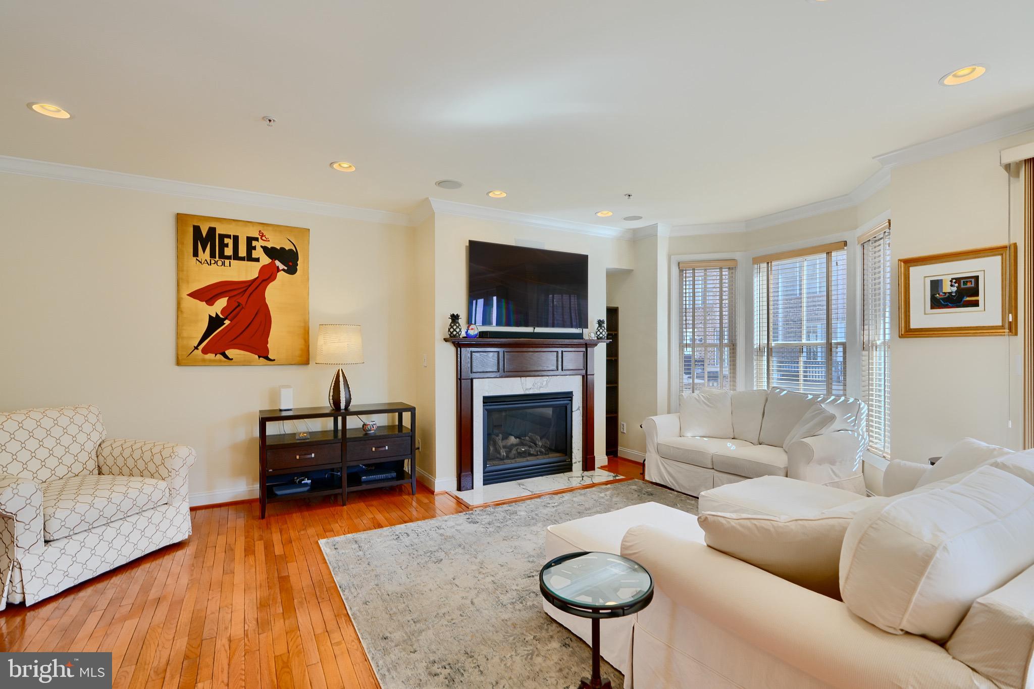 1221 Dockside Circle Baltimore, MD 21224 - Photo 21 of 57 a living room with furniture fireplace and flat screen tv