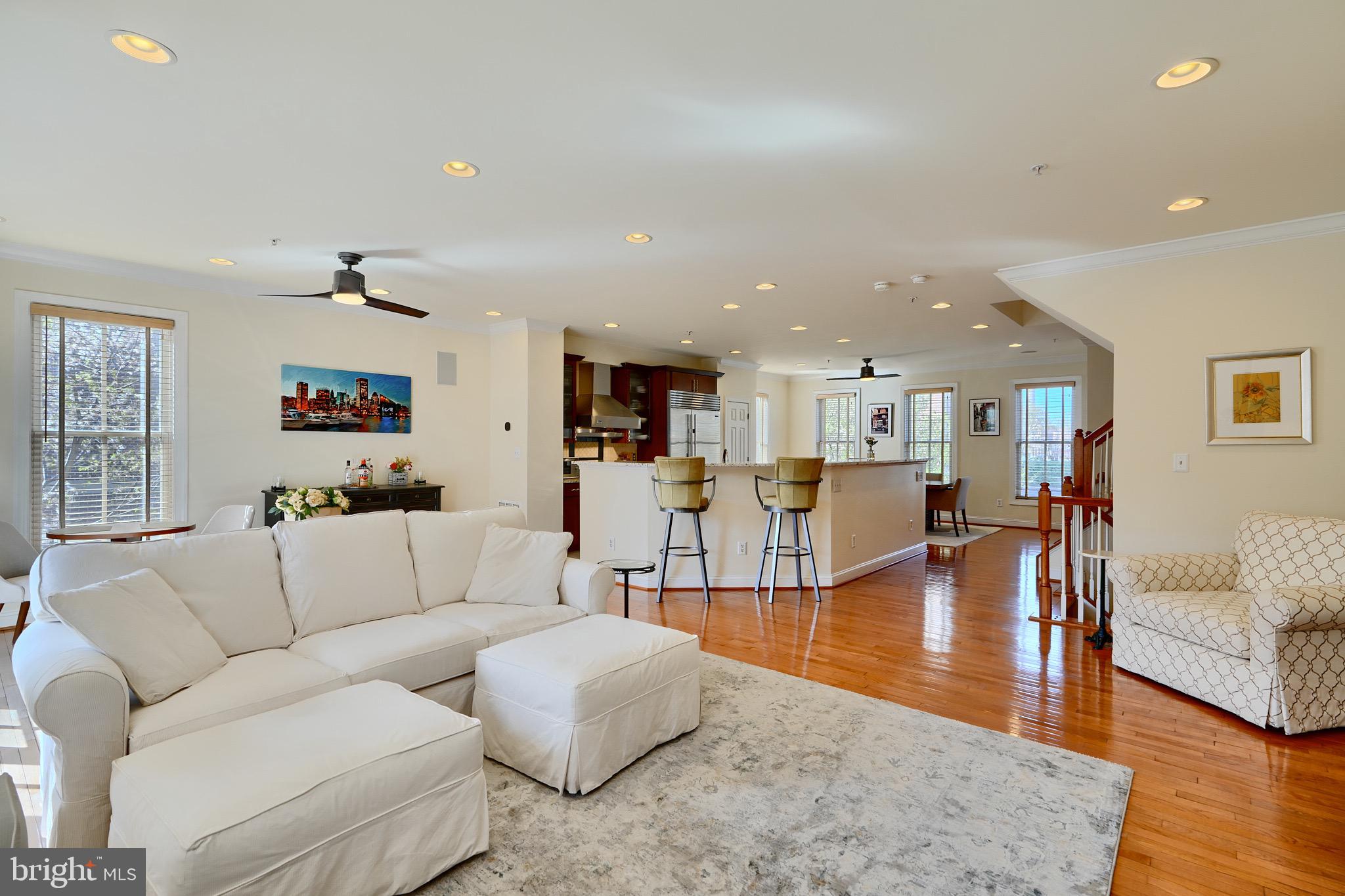 1221 Dockside Circle Baltimore, MD 21224 - Photo 23 of 57 a living room with furniture and a wooden floor