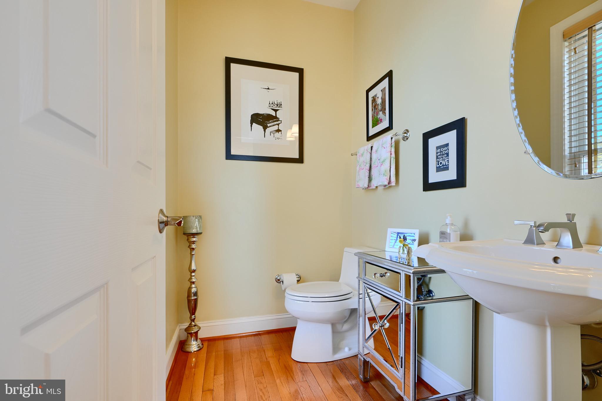 1221 Dockside Circle Baltimore, MD 21224 - Photo 26 of 57 a bathroom with a sink and a mirror