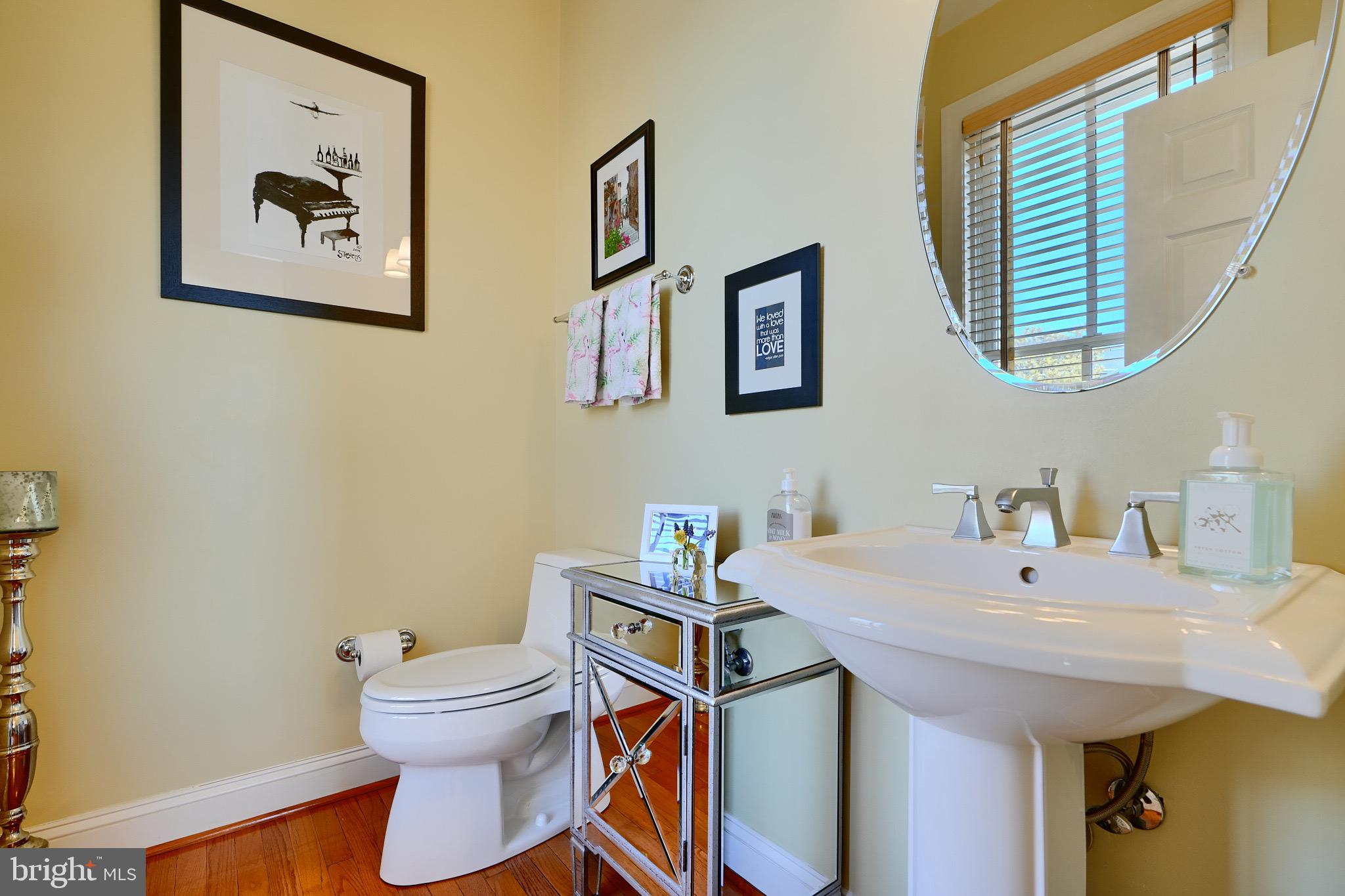 1221 Dockside Circle Baltimore, MD 21224 - Photo 27 of 57 a bathroom with a sink and a mirror