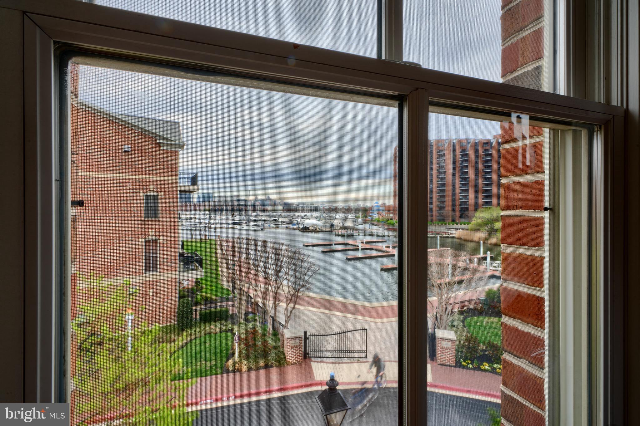 1221 Dockside Circle Baltimore, MD 21224 - Photo 34 of 57 a view of a balcony with a floor to ceiling window and wooden floor