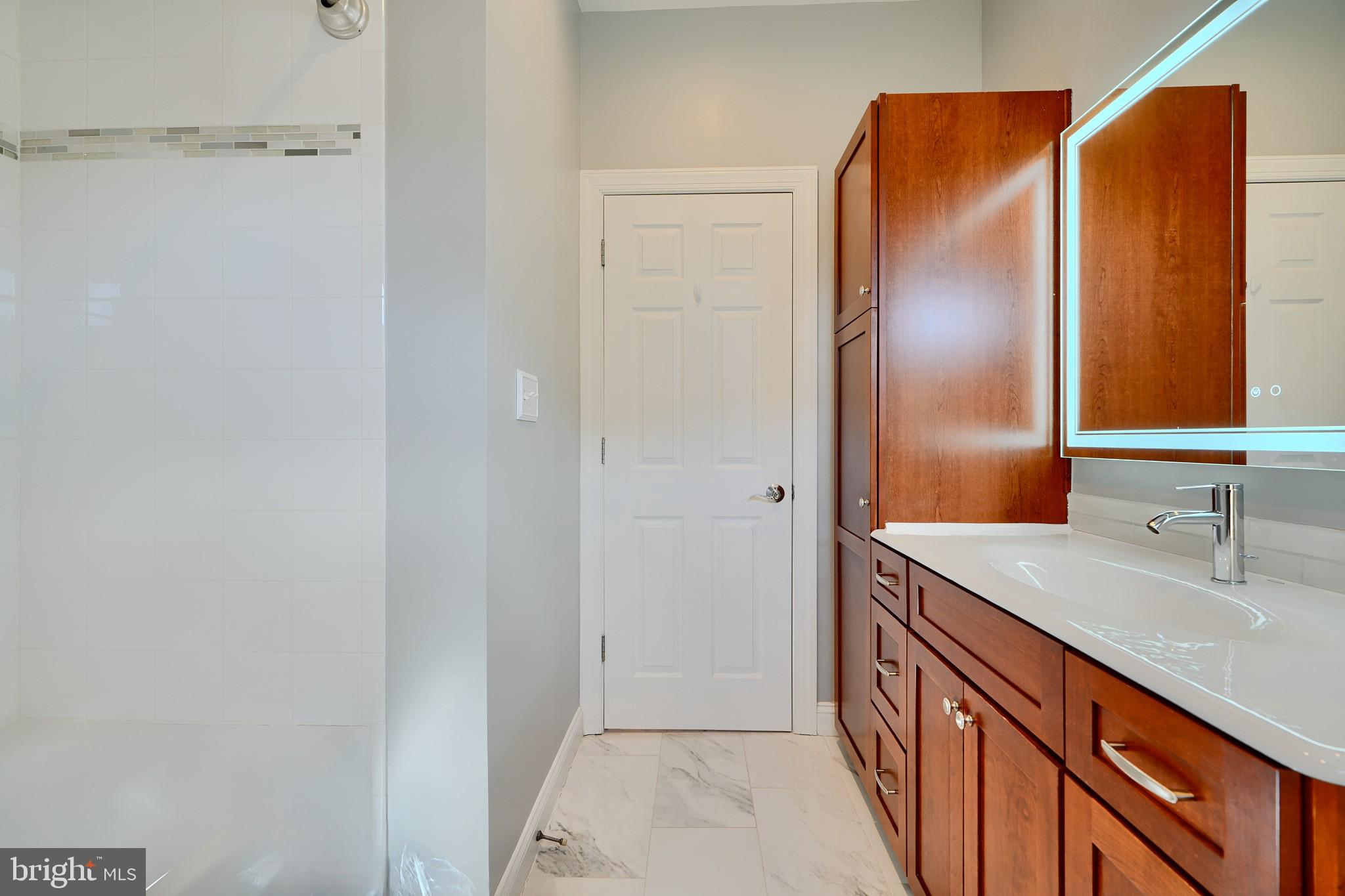 1221 Dockside Circle Baltimore, MD 21224 - Photo 38 of 57 a bathroom with a sink and a mirror