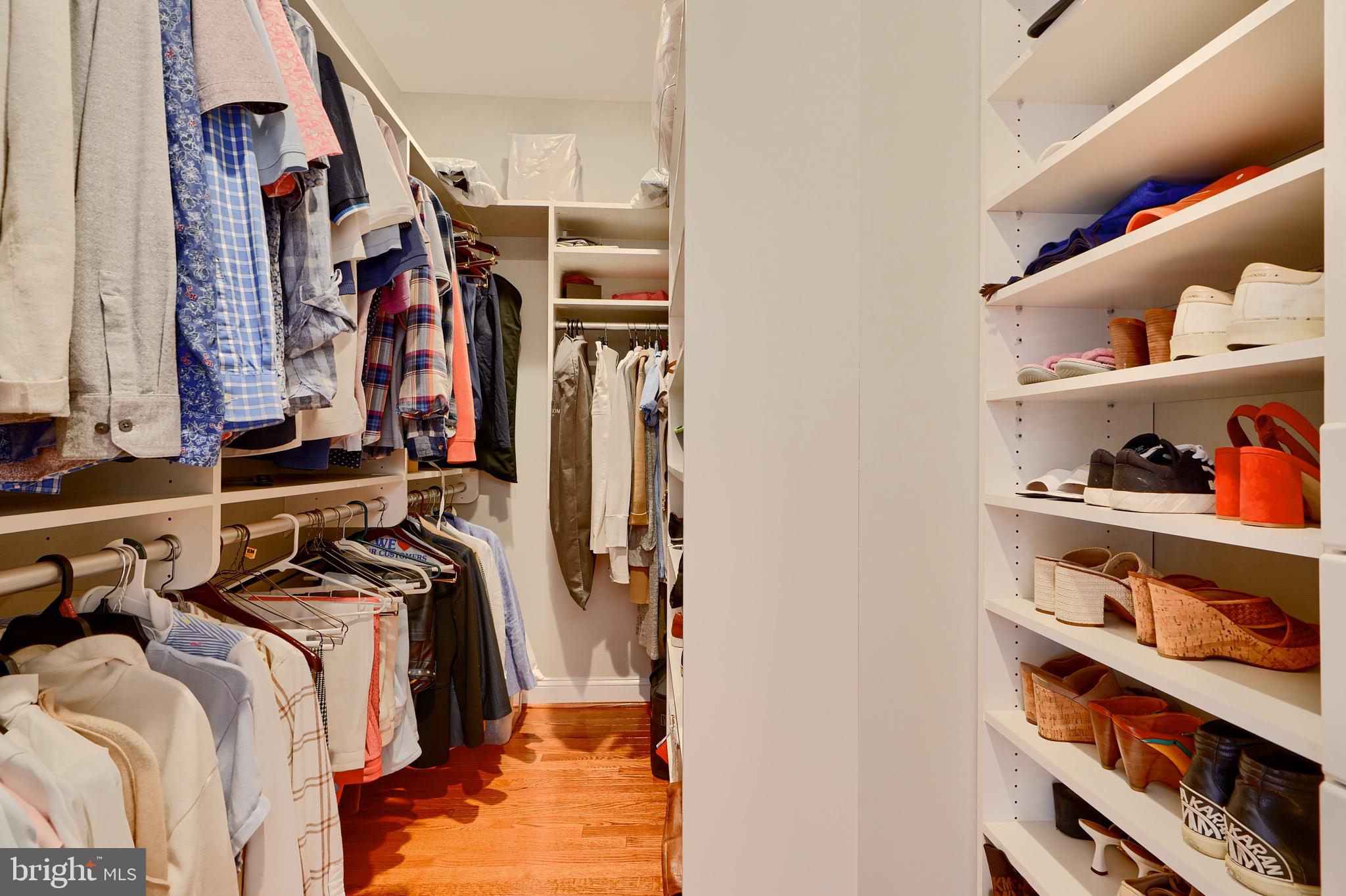 1221 Dockside Circle Baltimore, MD 21224 - Photo 42 of 57 a view of walk in closet with clothes and shoes