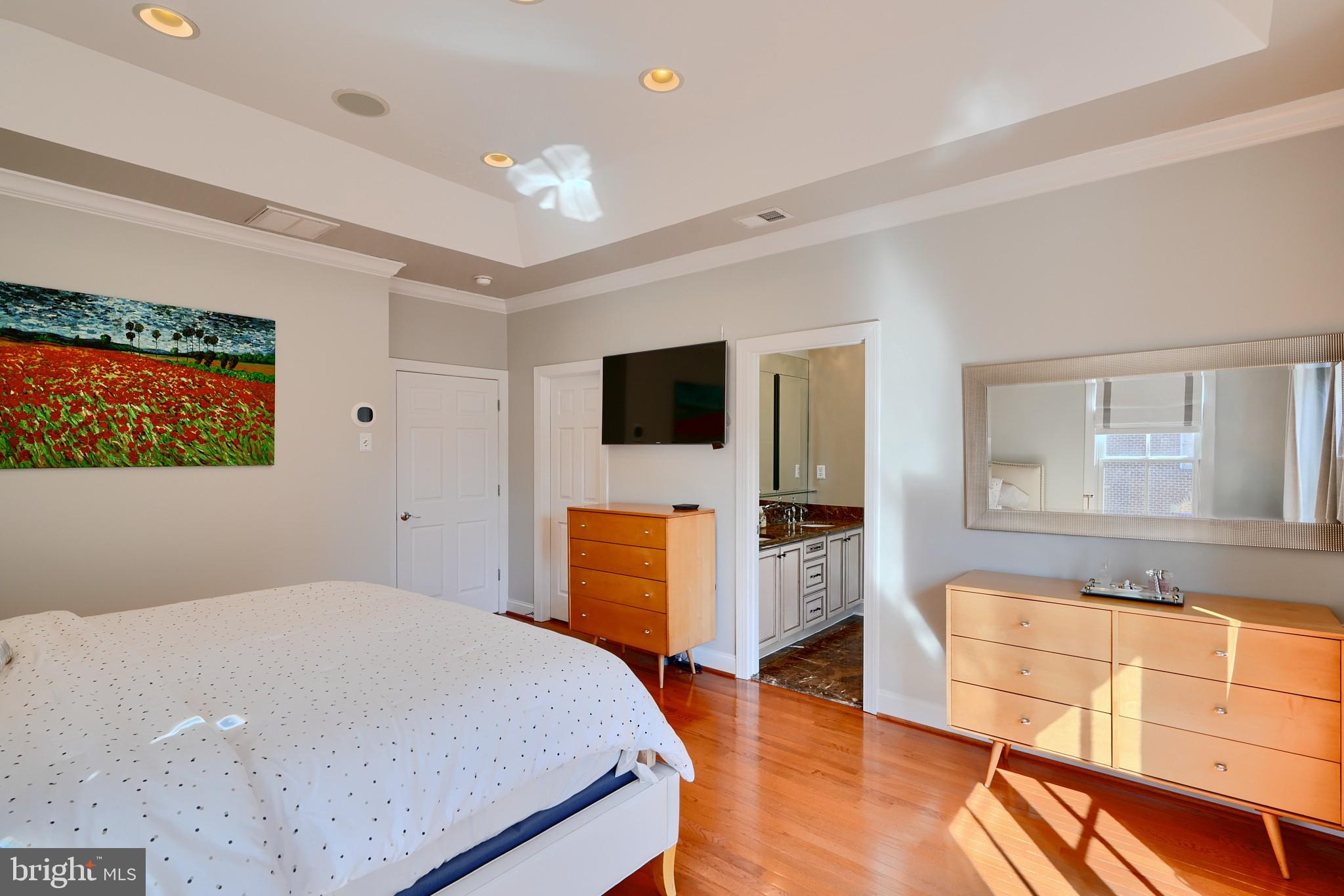 1221 Dockside Circle Baltimore, MD 21224 - Photo 43 of 57 a bedroom with a bed and wooden floor