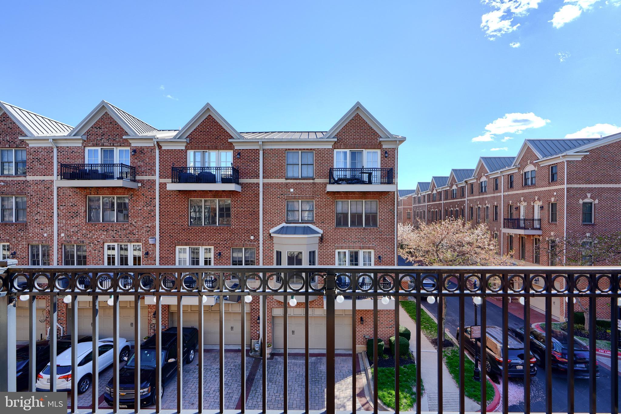 1221 Dockside Circle Baltimore, MD 21224 - Photo 49 of 57 a front view of a residential apartment building with glass windows