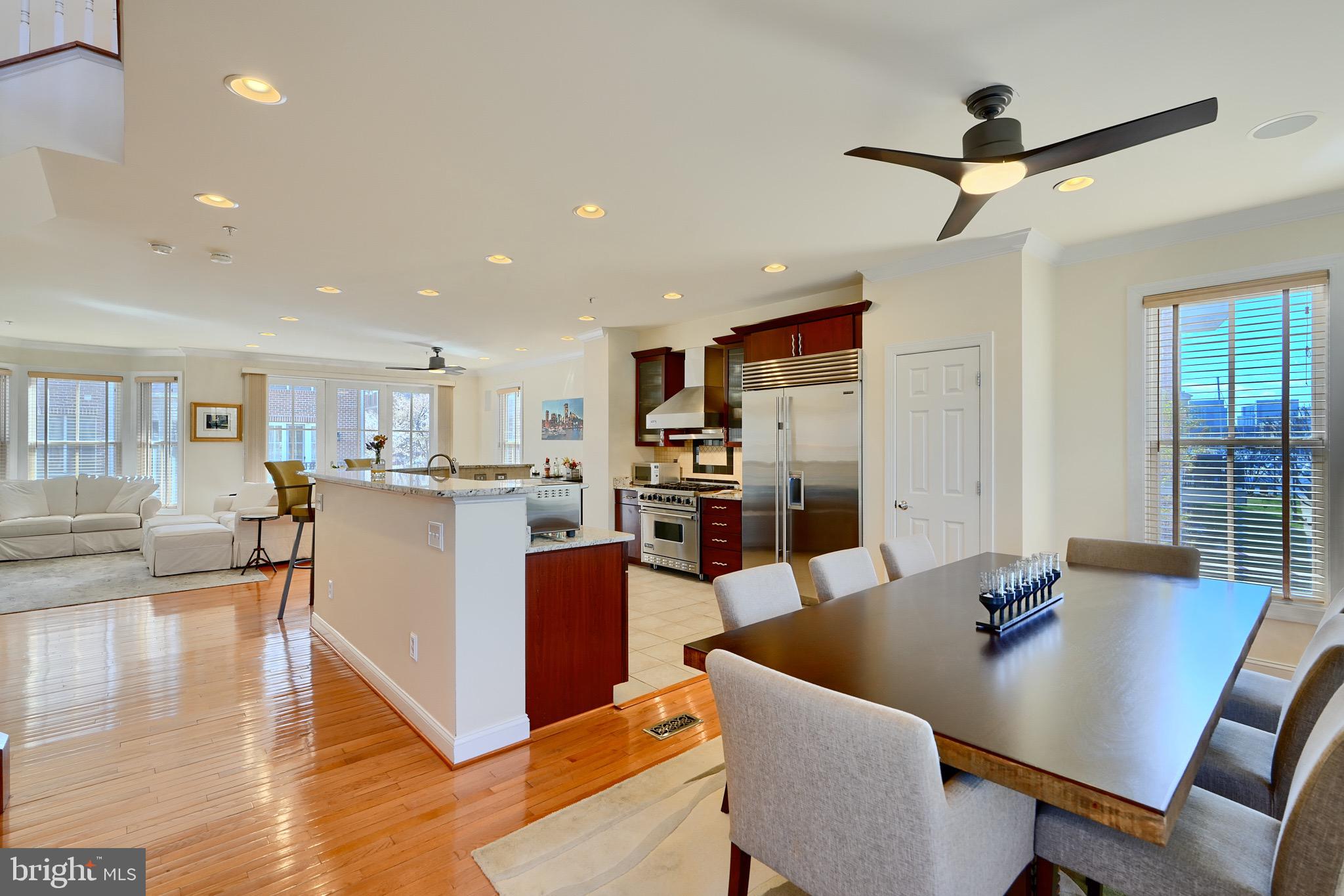 1221 Dockside Circle Baltimore, MD 21224 - Photo 10 of 57 a living room with stainless steel appliances furniture a rug and a kitchen view