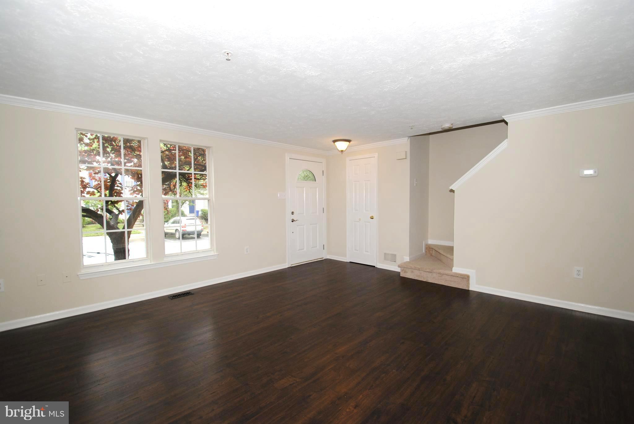 579 Quaker Ridge Court Arnold, MD 21012 - Photo 7 of 30 Open Living Room / Easy-Care Laminate Flooring