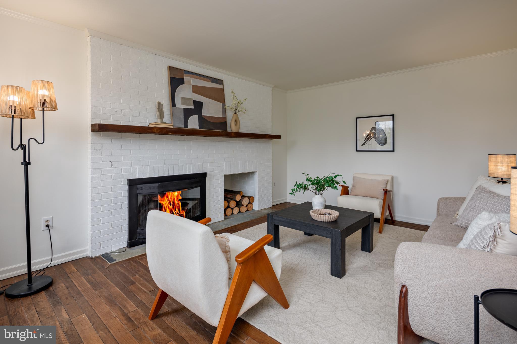 324 Flat Iron Square Road Church Hill, MD 21623 - Photo 2 of 47 a living room with furniture a table and a fireplace
