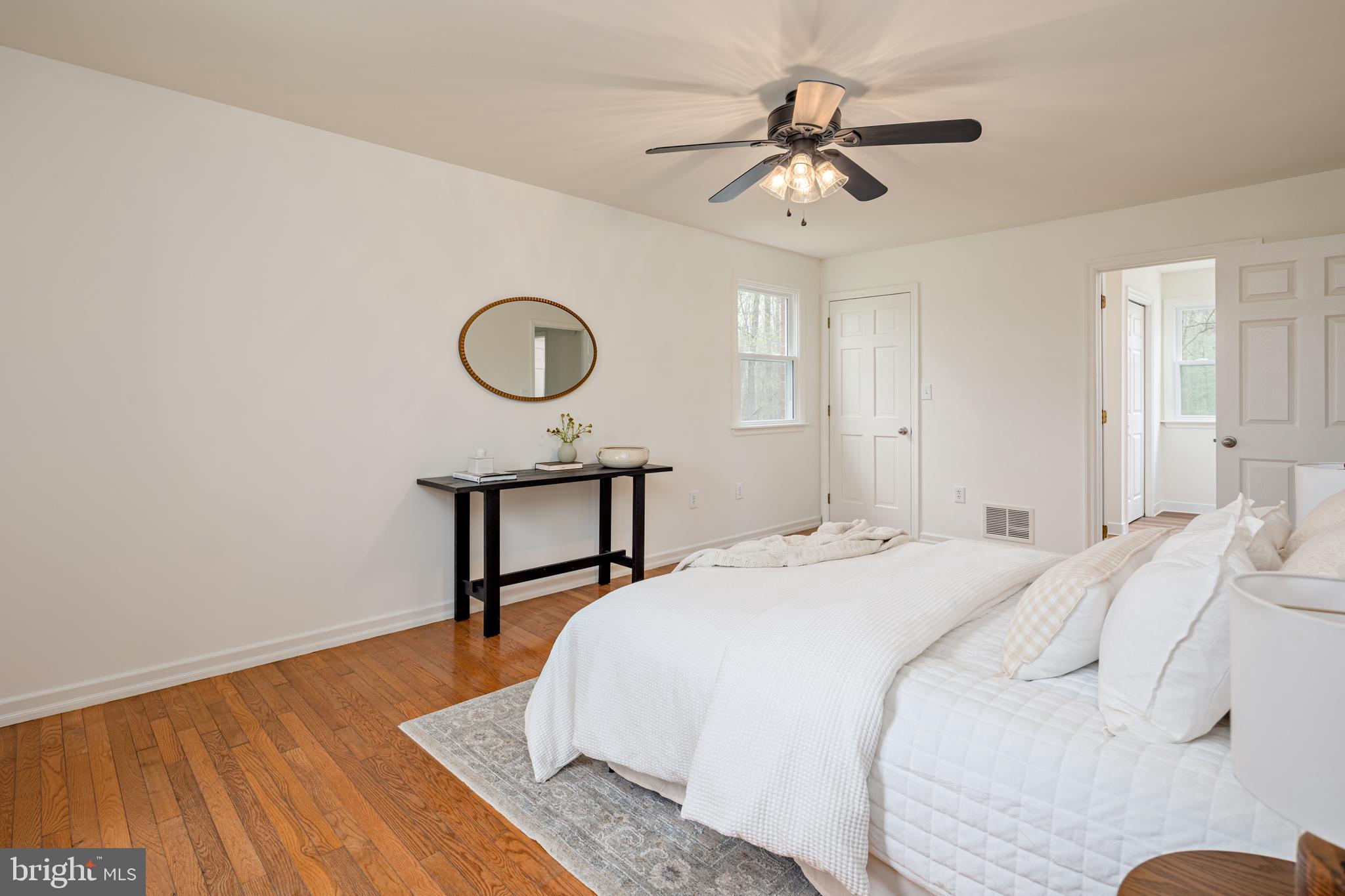 324 Flat Iron Square Road Church Hill, MD 21623 - Photo 26 of 47 a bedroom with a bed a window and a chandelier