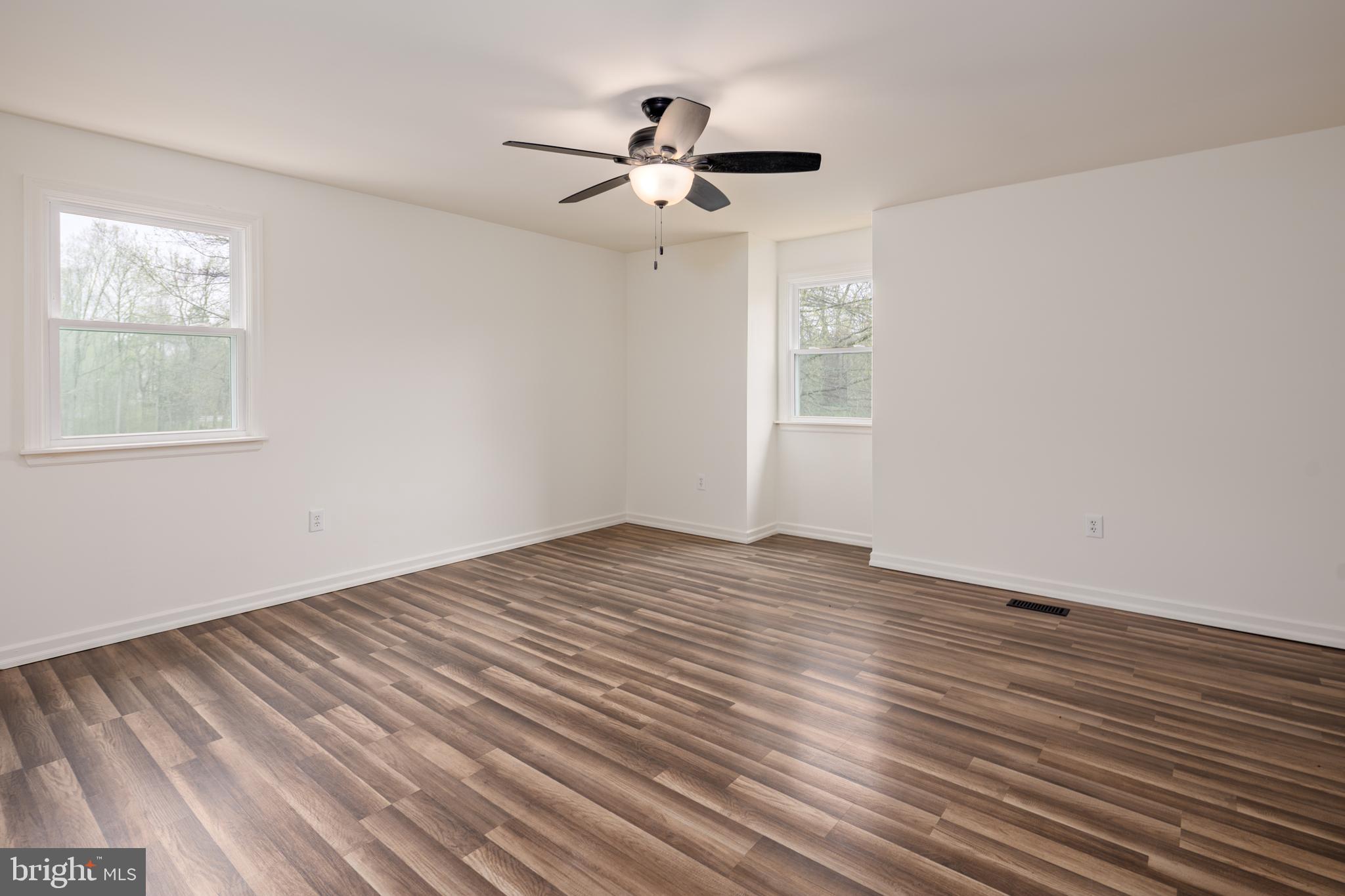 324 Flat Iron Square Road Church Hill, MD 21623 - Photo 31 of 47 a view of empty room with wooden floor and fan