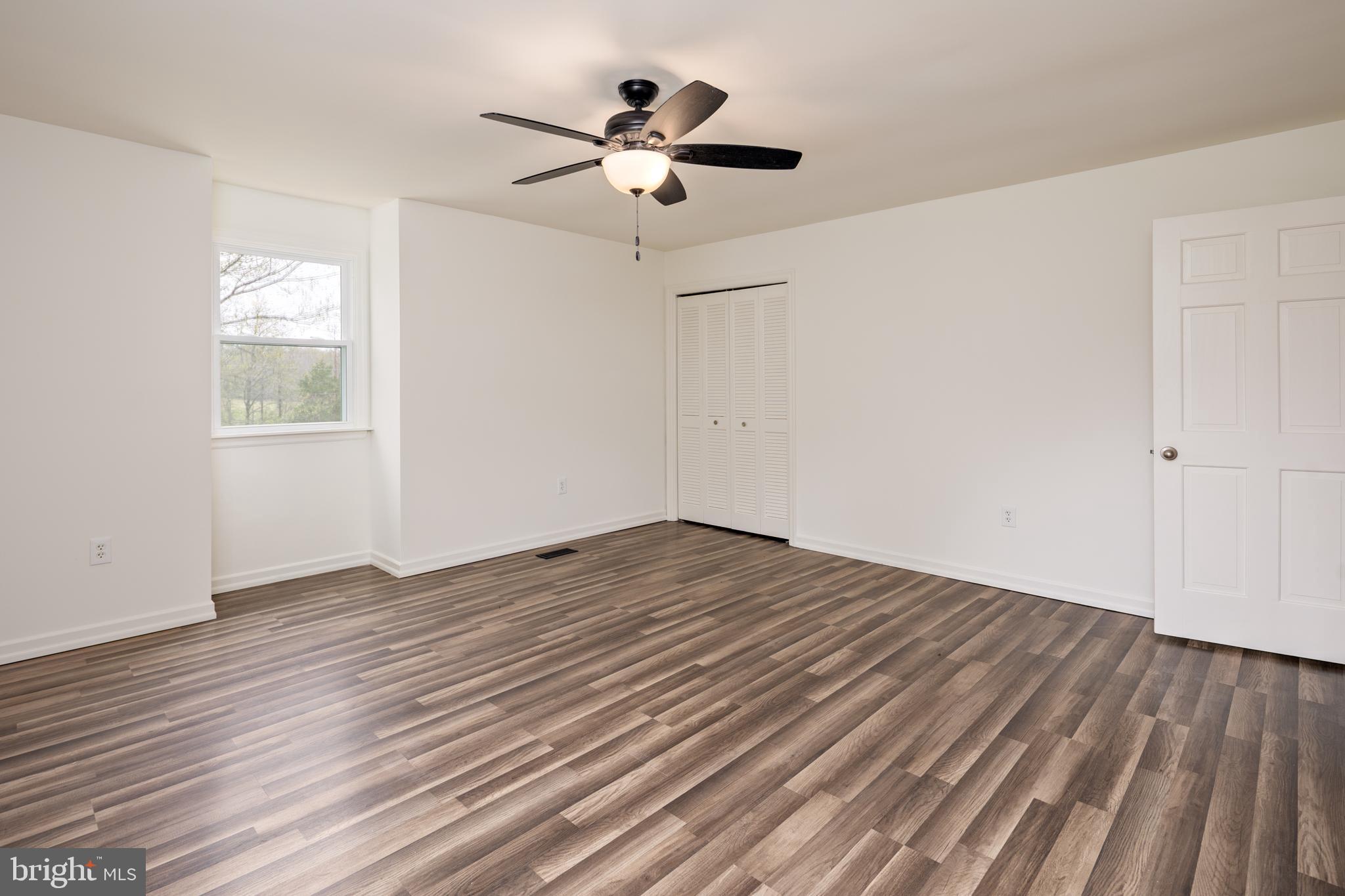 324 Flat Iron Square Road Church Hill, MD 21623 - Photo 33 of 47 wooden floor in an empty room with a window