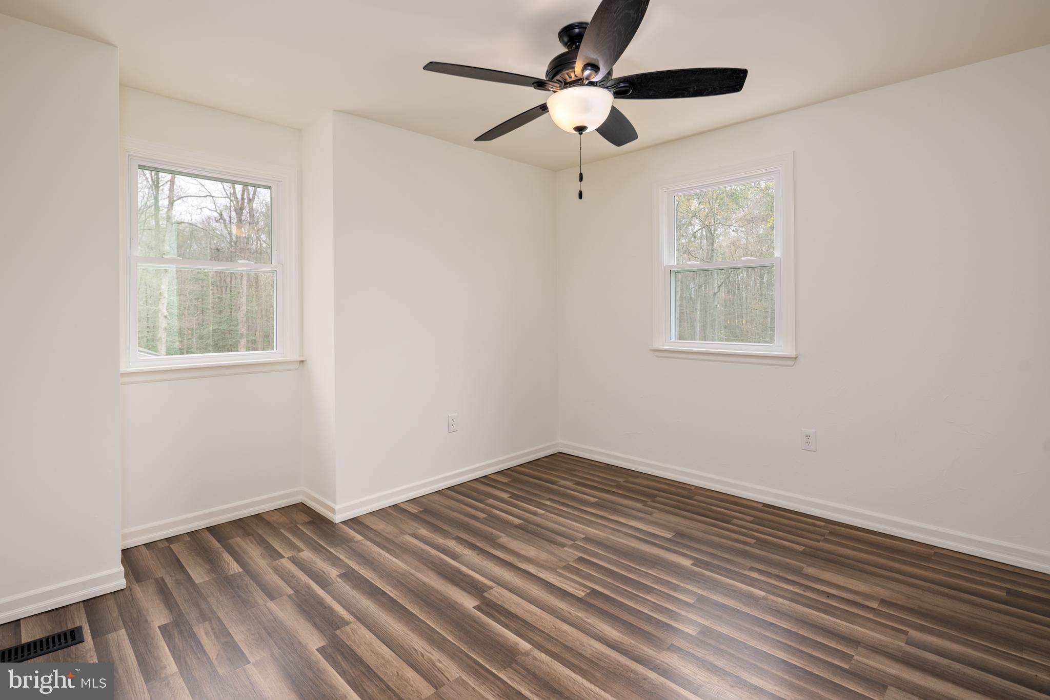 324 Flat Iron Square Road Church Hill, MD 21623 - Photo 34 of 47 wooden floor in an empty room with a window