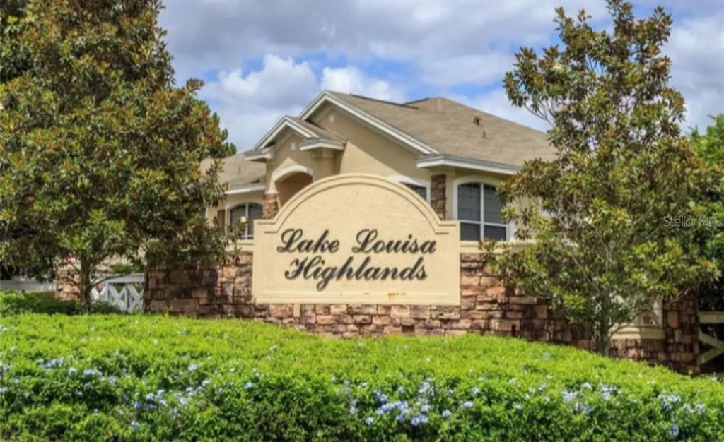 13319 Via Roma Circle Clermont, FL 34711 - Photo 37 of 44 a sign on the side of a building