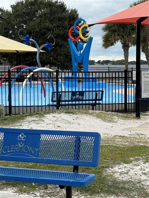13319 Via Roma Circle Clermont, FL 34711 - Photo 42 of 44 a view of swimming pool with a patio and a yard