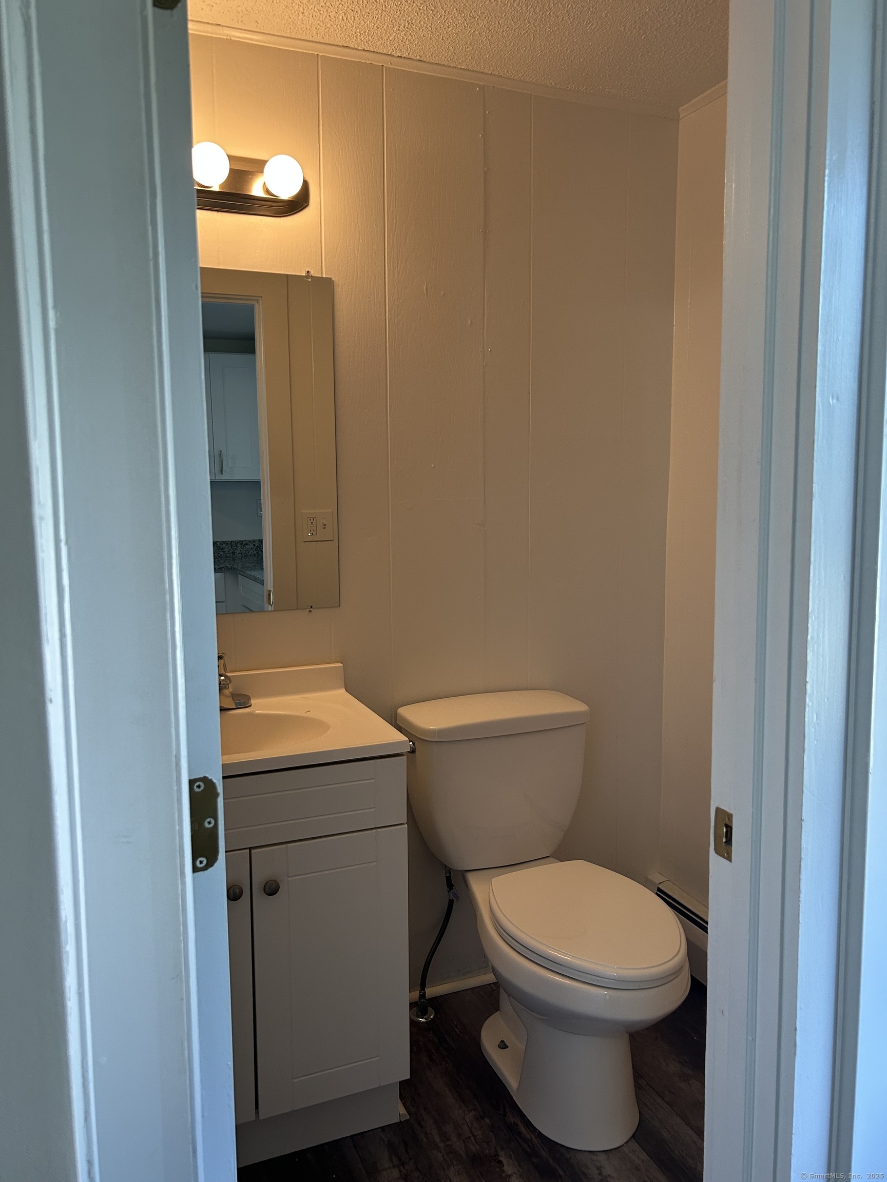121 Pleasant Street Windsor, CT 06095 - Photo 7 of 8 a bathroom with a toilet and a sink