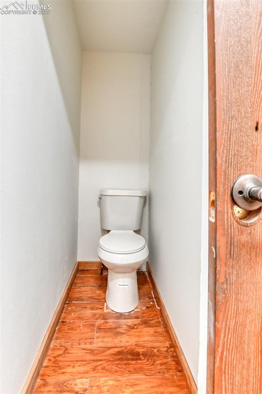 6175 Mulberry Road Calhan, CO 80808 - Photo 18 of 46 a white toilet sitting next to a shower