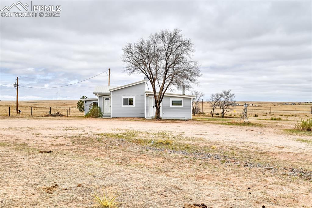 6175 Mulberry Road Calhan, CO 80808 - Photo 2 of 46 a view of a lake with a house