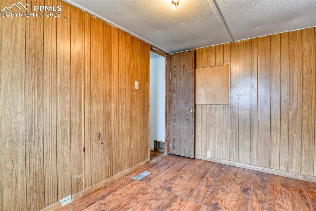 6175 Mulberry Road Calhan, CO 80808 - Photo 24 of 46 a view of a big room with wooden walls