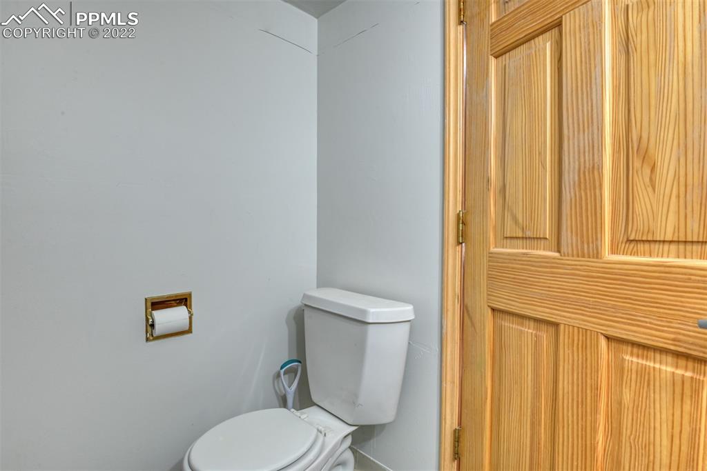 6175 Mulberry Road Calhan, CO 80808 - Photo 27 of 46 a white toilet sitting next to a window