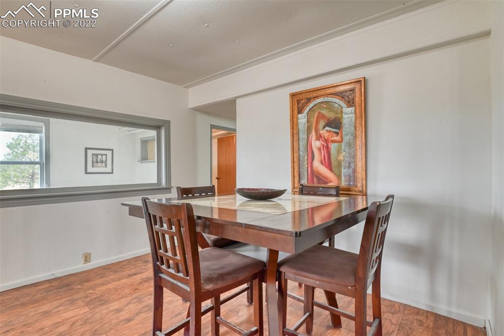 6175 Mulberry Road Calhan, CO 80808 - Photo 36 of 46 a view of a dining room with furniture and window