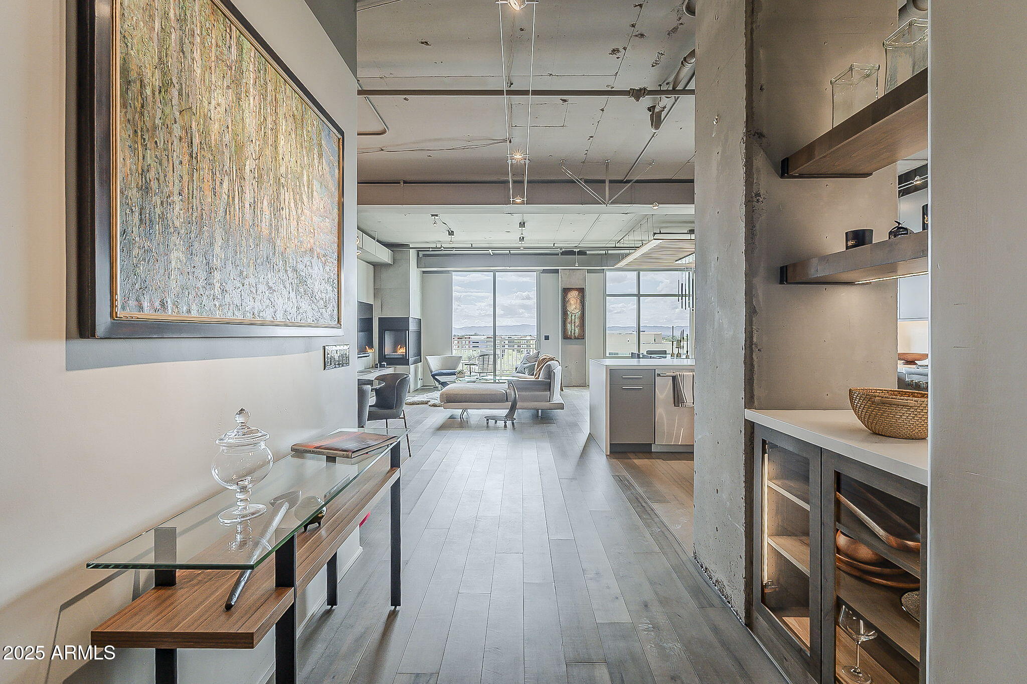 2211 East Camelback Road, Unit 605 Phoenix, AZ 85016 - Photo 13 of 56 a kitchen with sink cabinets and wooden floor