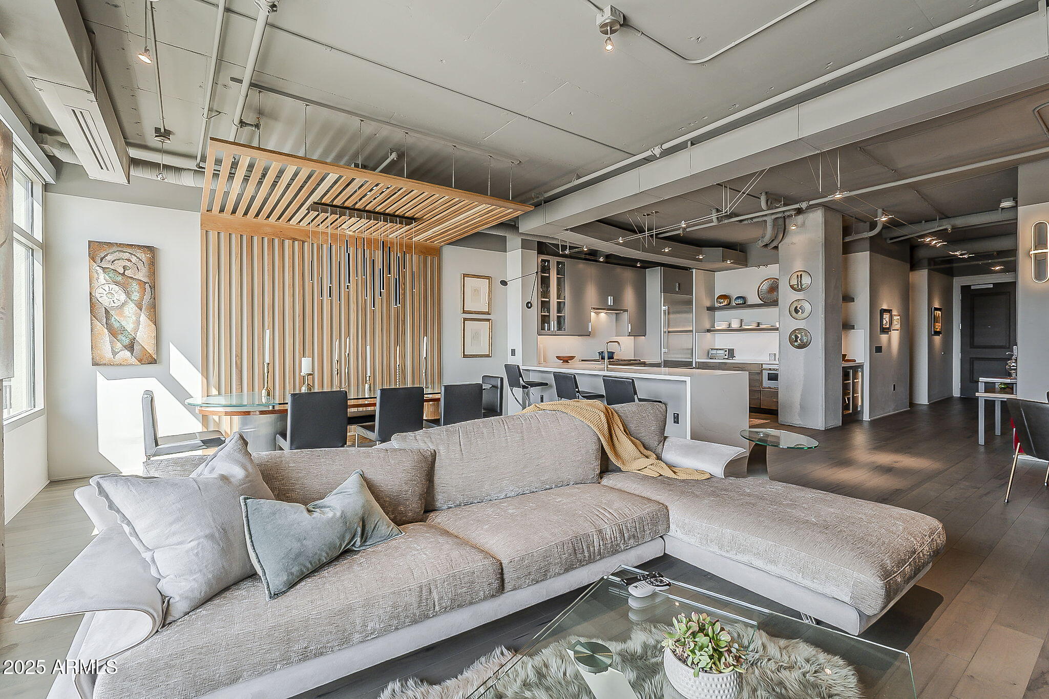 2211 East Camelback Road, Unit 605 Phoenix, AZ 85016 - Photo 15 of 56 a living room with furniture and a fireplace