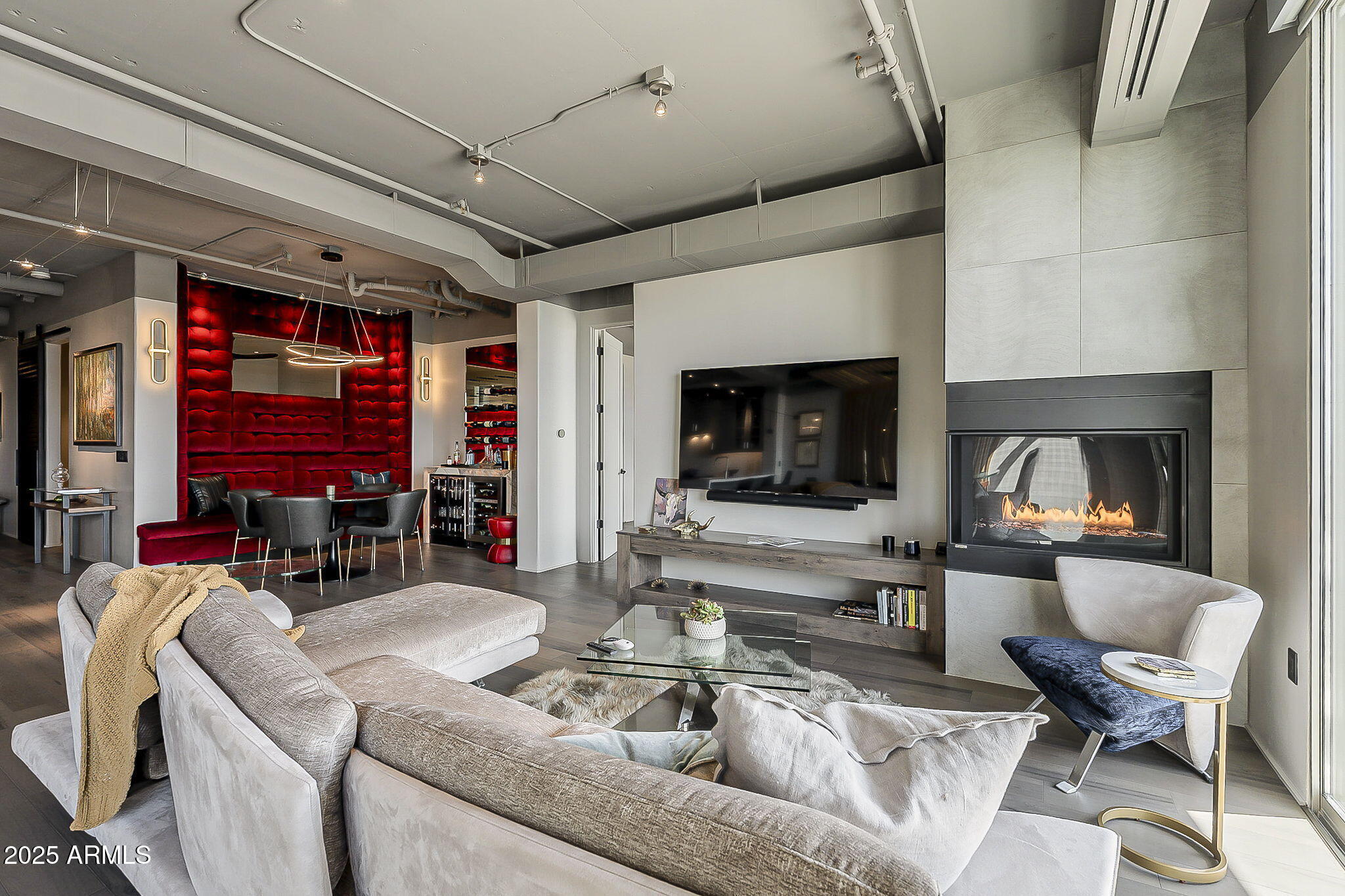2211 East Camelback Road, Unit 605 Phoenix, AZ 85016 - Photo 16 of 56 a living room with furniture and a fireplace