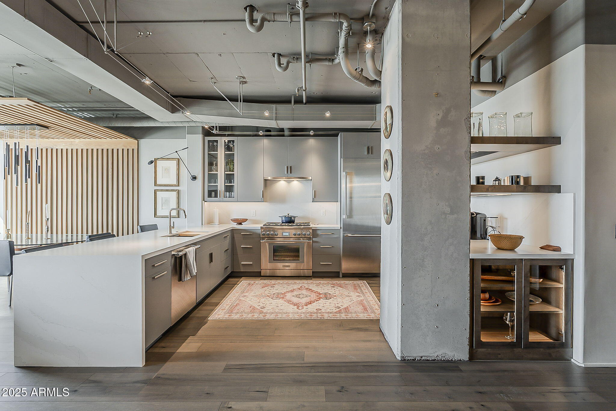 2211 East Camelback Road, Unit 605 Phoenix, AZ 85016 - Photo 18 of 56 a large white kitchen with wooden floor and a window