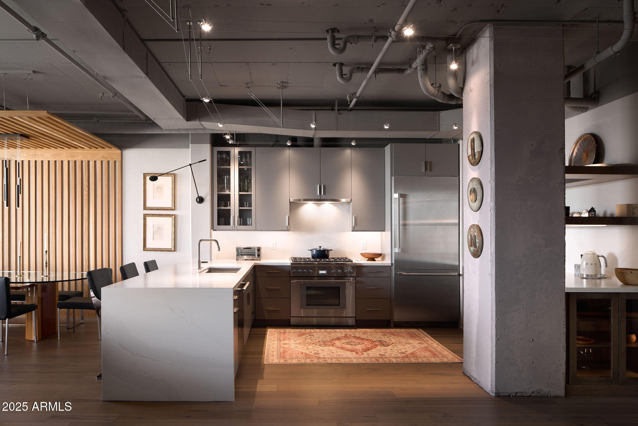 2211 East Camelback Road, Unit 605 Phoenix, AZ 85016 - Photo 2 of 56 a living room with granite countertop furniture and a fireplace