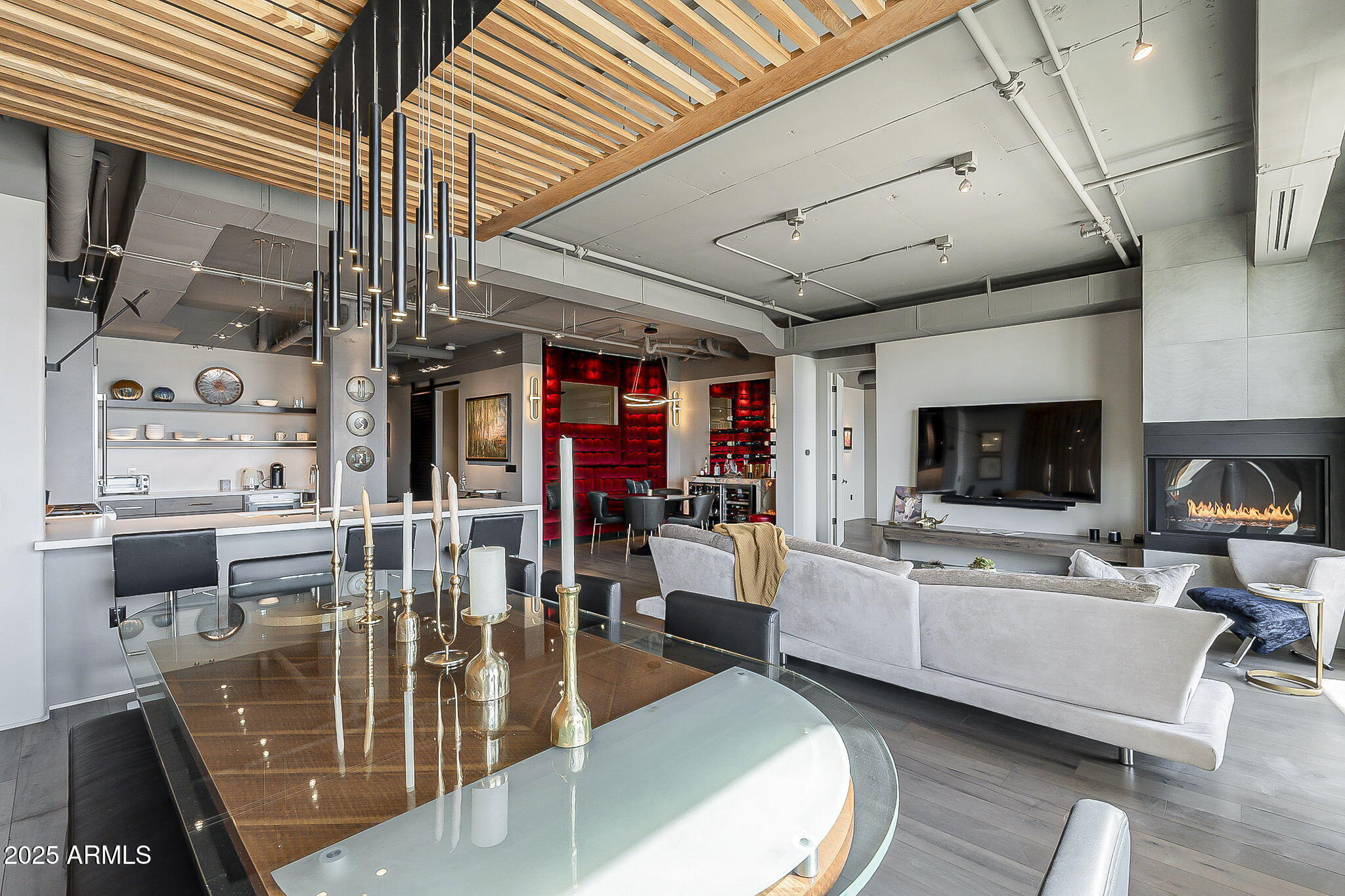 2211 East Camelback Road, Unit 605 Phoenix, AZ 85016 - Photo 27 of 56 a living room with furniture and flat screen tv