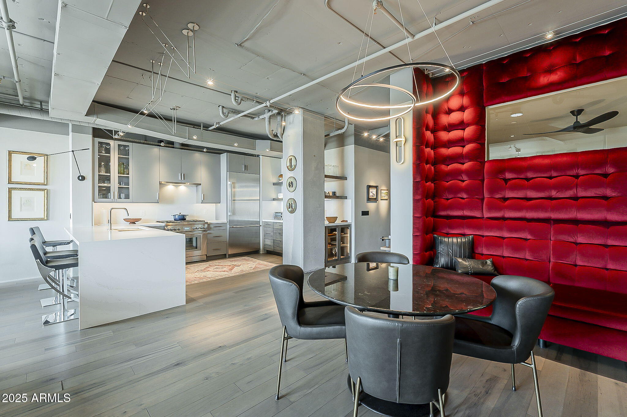 2211 East Camelback Road, Unit 605 Phoenix, AZ 85016 - Photo 28 of 56 a dining room with furniture and wooden floor