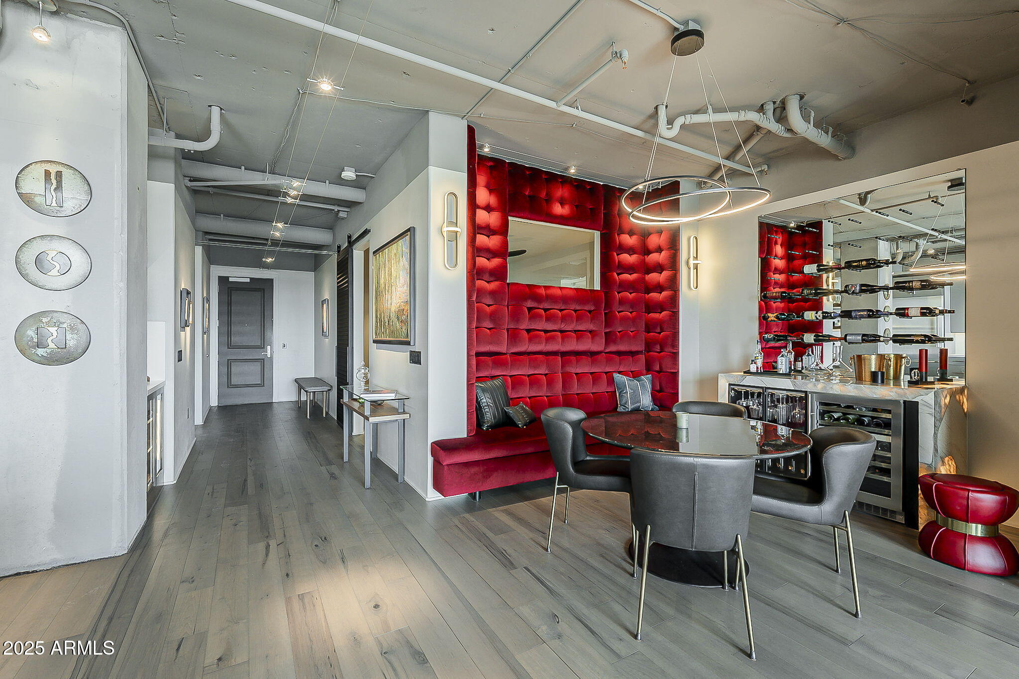 2211 East Camelback Road, Unit 605 Phoenix, AZ 85016 - Photo 30 of 56 a view of a dining room with furniture window and wooden floor