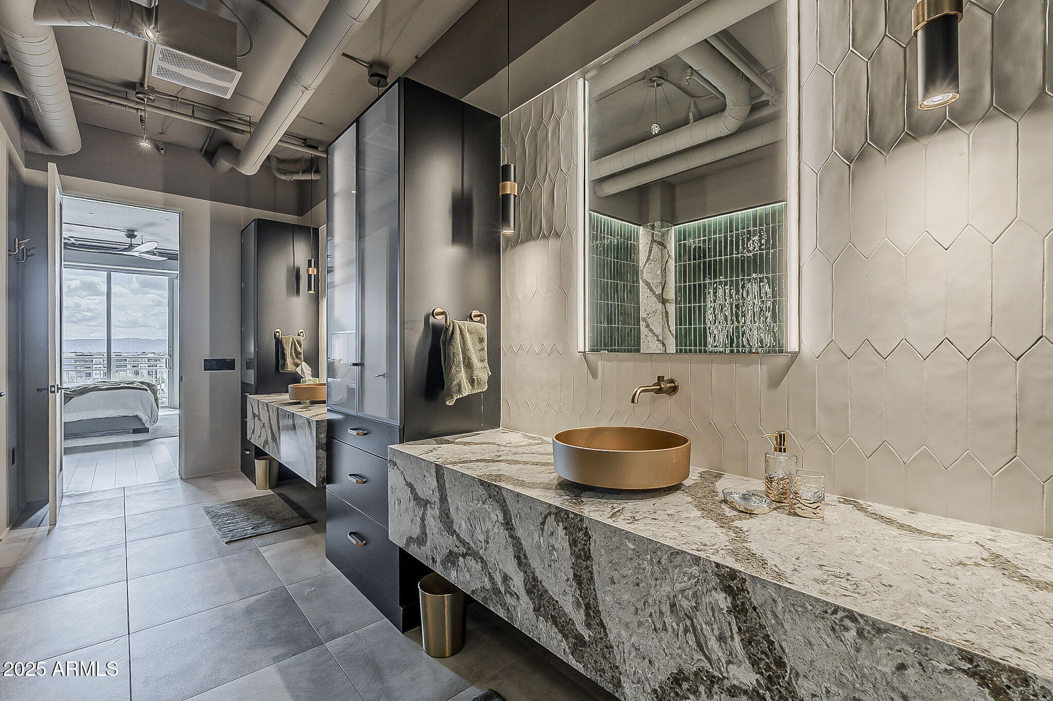 2211 East Camelback Road, Unit 605 Phoenix, AZ 85016 - Photo 36 of 56 a bathroom with a granite countertop sink a mirror and shower