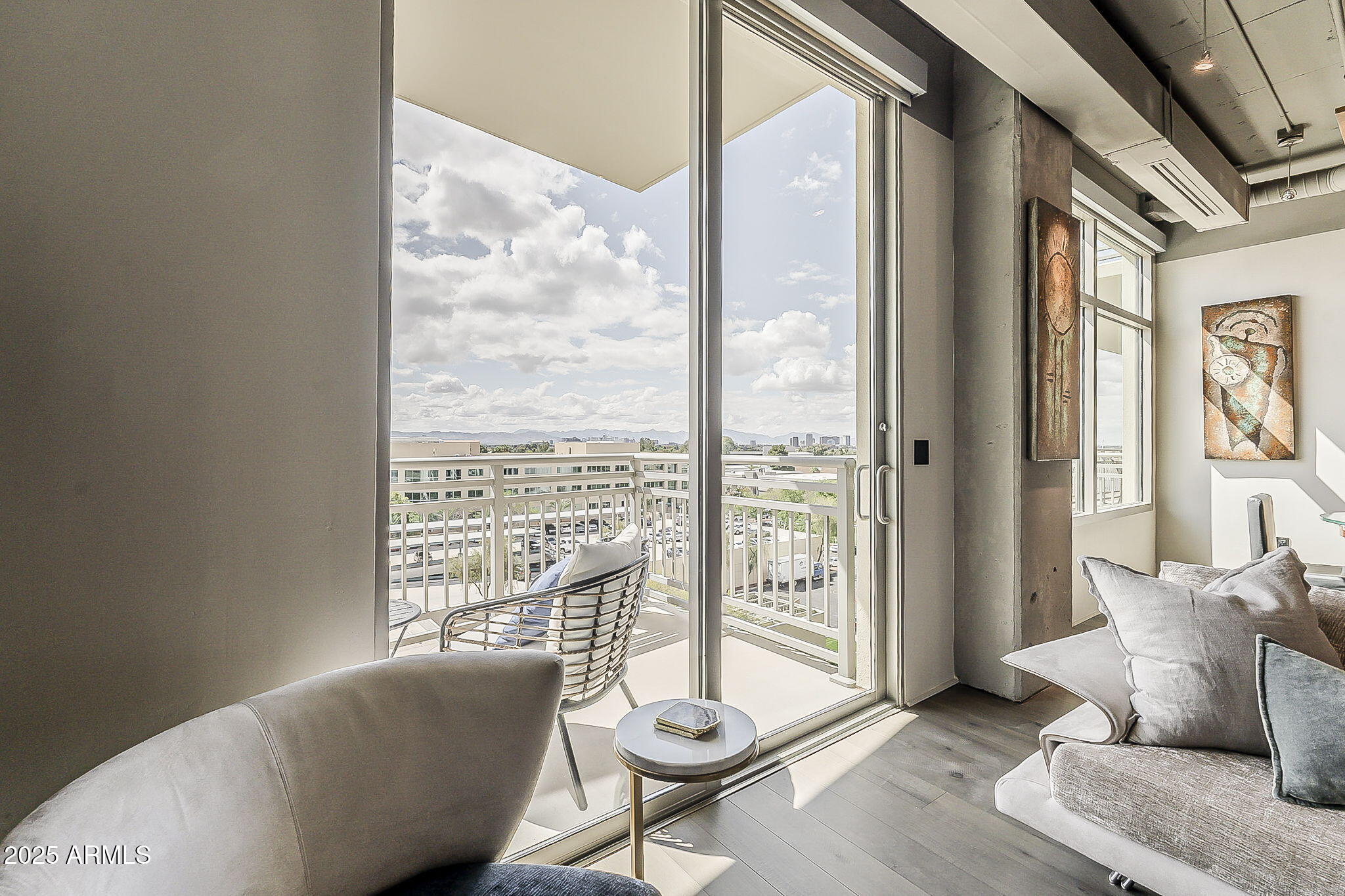 2211 East Camelback Road, Unit 605 Phoenix, AZ 85016 - Photo 52 of 56 a living room with furniture and a large window