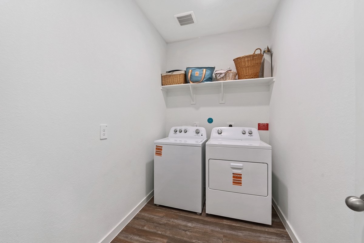 815 Devils Bridge Street Conroe, TX 77303 - Photo 16 of 25 a utility room with dryer and washer