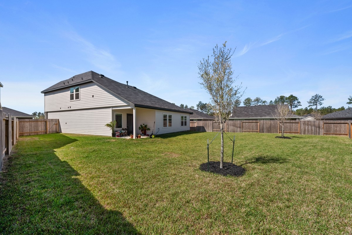 815 Devils Bridge Street Conroe, TX 77303 - Photo 22 of 25 a house view with a outdoor space