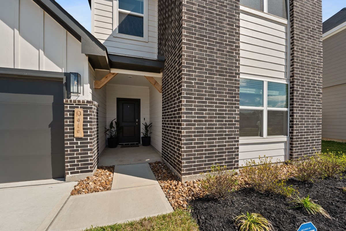 815 Devils Bridge Street Conroe, TX 77303 - Photo 3 of 25 a front view of a house with a garage