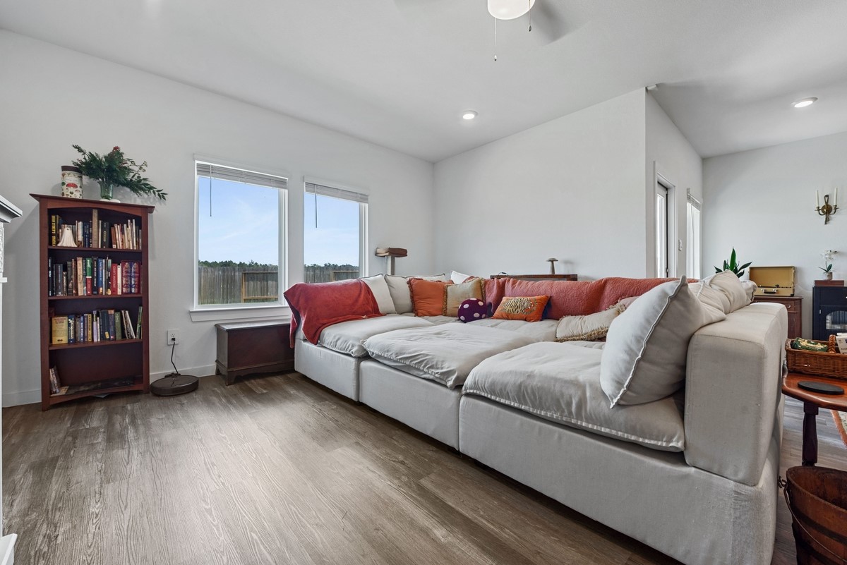 815 Devils Bridge Street Conroe, TX 77303 - Photo 8 of 25 a bed room with a bed and a book shelf