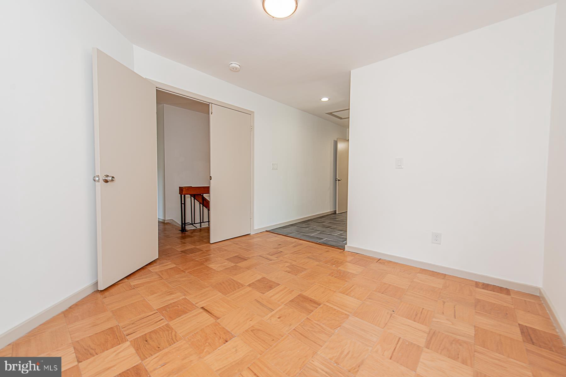 5301 Lightning View Road Columbia, MD 21045 - Photo 29 of 47 Master bedroom with parquet flooring