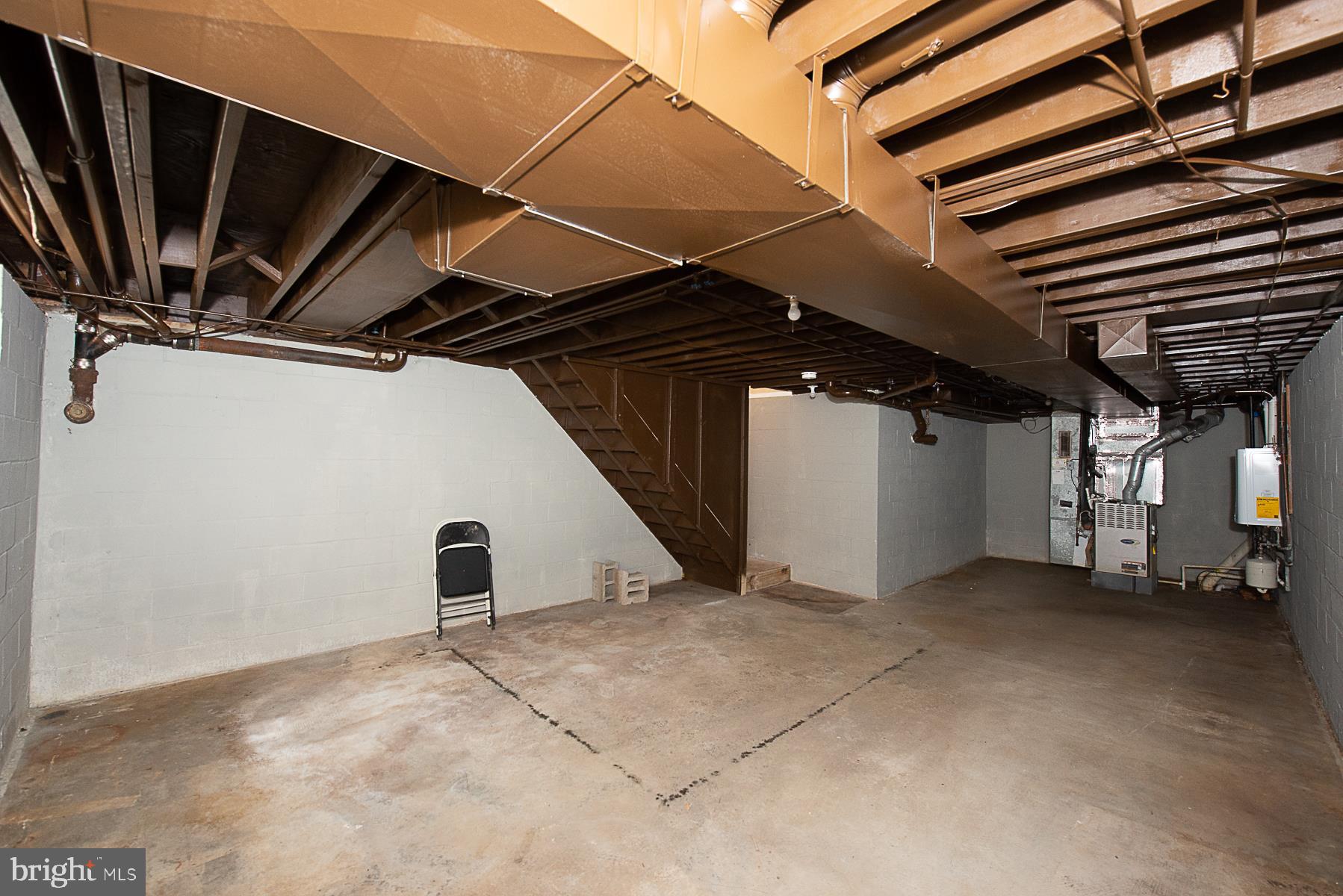 5301 Lightning View Road Columbia, MD 21045 - Photo 41 of 47 Basement with tankless water heater