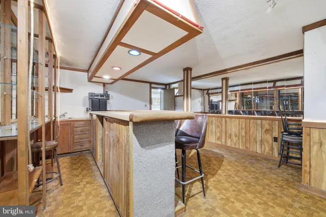 a view of a chairs and table in a room