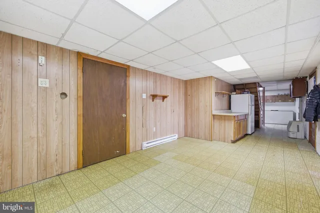 a bathroom with a sink toilet and a mirror