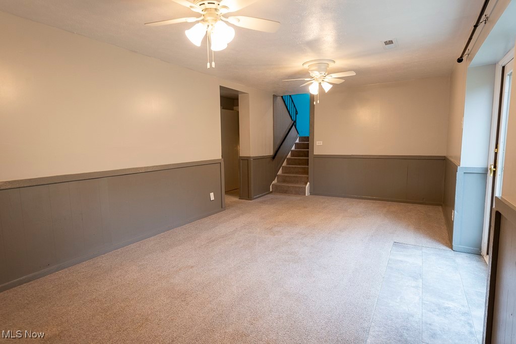 11819 Sheldon Road Mantua, OH 44255 - Photo 27 of 46 Carpeted family room with ceiling fan