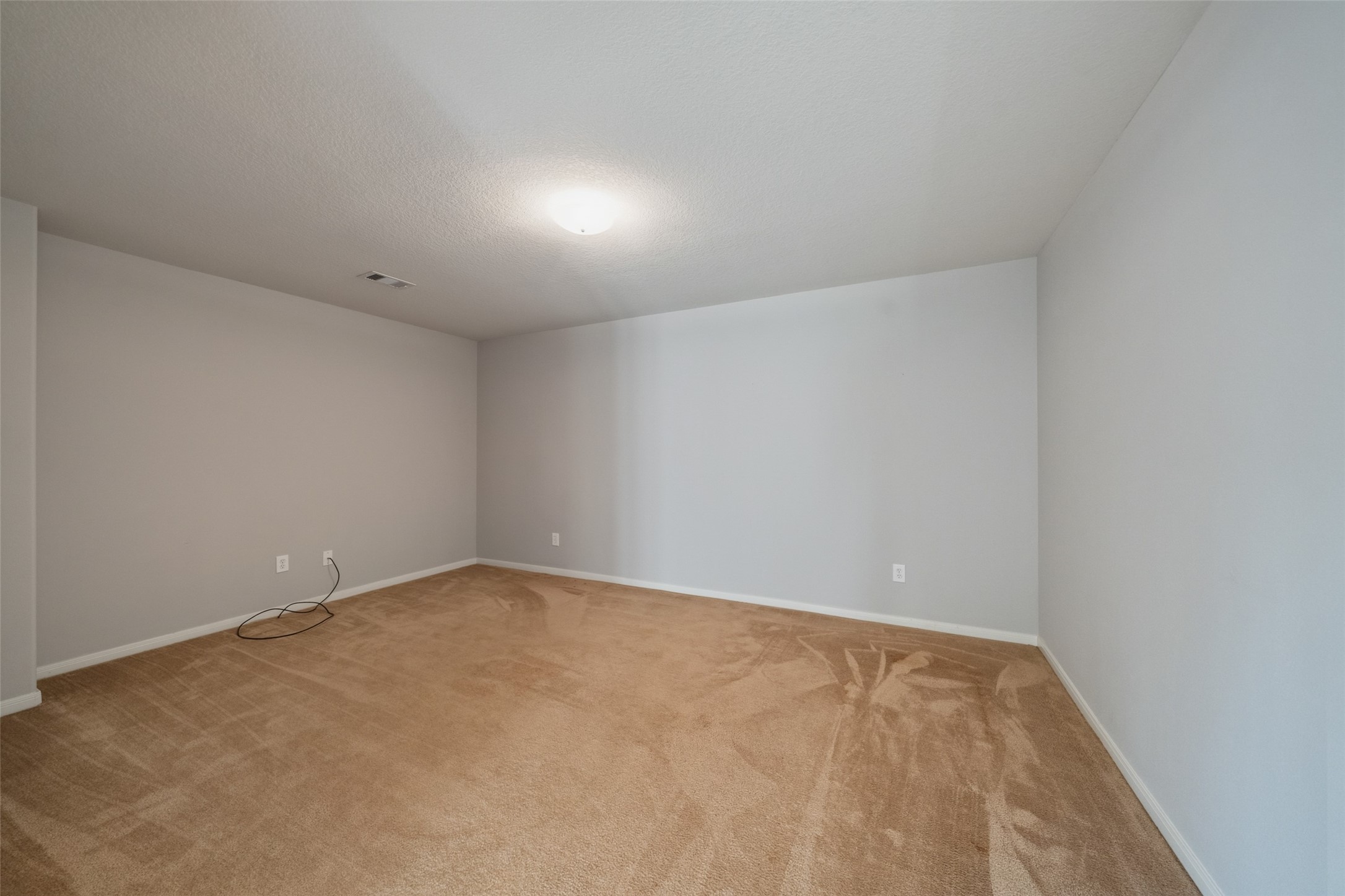 16820 Infield Court Conroe, TX 77385 - Photo 31 of 44 an empty room with a workbench